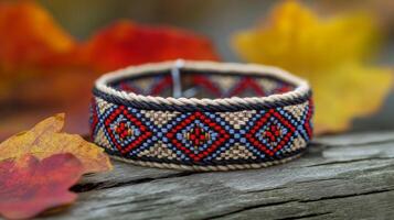 Vibrant Woven Bracelet, Autumn Leaves Background photo