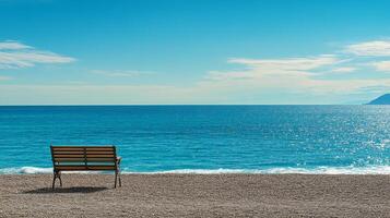 Tranquil Beach Scene with Wooden Bench photo