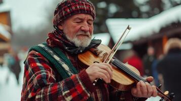 Elderly Man Playing Violin in Winter photo