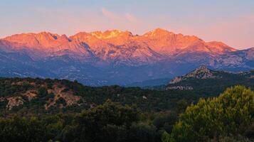 Majestic Mountain Range at Sunrise or Sunset photo