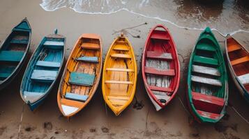 Colorful Wooden Rowboats on the Beach photo