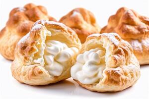 Close-up of cream puffs with whipped cream filling. photo