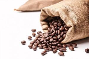 Coffee beans spilling from burlap sack. photo