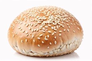 Closeup of a sesame seed bun on a white background. photo