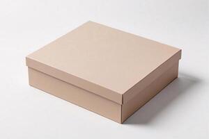 Closed beige cardboard box on white background. photo