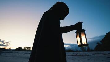 Old Man With Tabarro And Lantern At The Beach photo