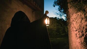 Lantern Mason Wanders the Cobblestone Paths photo