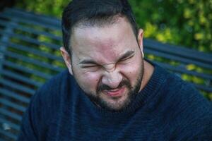 Man Shows Disgust After Lemon Bite photo