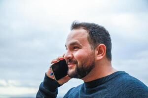 Man Radiates Joy During a Phone Conversation photo