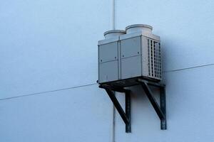 Air conditioning unit mounted on a wall for efficient cooling photo
