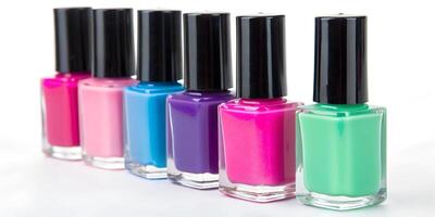 Nail polishes in bottles on color background, flat lay. Space for text photo