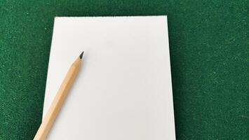 pencil and notebook on the table photo
