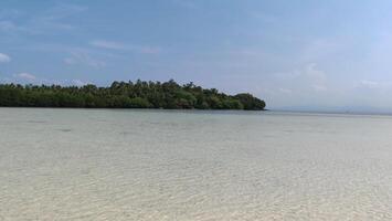 beautiful view of the tropical beach of Pahawang Island, Lampung. Landscape in the highland natural park. Panoramic view by the sea. photo
