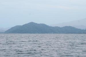 beautiful view of the tropical beach of Pahawang Island, Lampung. Landscape in the highland natural park. Panoramic view by the sea. photo