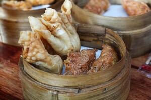 Gacoan noodles are a popular food in Indonesia. Made from noodles served with spicy spices and fried dumplings. photo
