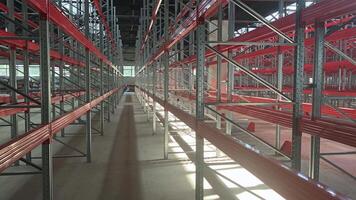 Logistics warehouse concept with empty high pallet racks, shelving system video