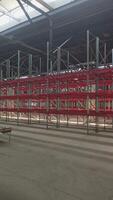 Logistics warehouse concept with empty high pallet racks, shelving system video
