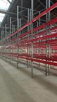 Logistics warehouse concept with empty high pallet racks, shelving system video
