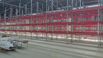 Logistics warehouse concept with empty high pallet racks, shelving system video