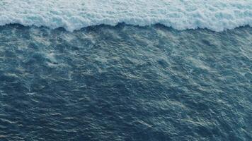 Endless ocean waves top view waves moving endless and ever-changing nature of sea. Tidal pulse high-angle view of ocean waves revealing pulsating energy flow and crash raw power motion of ocean. video