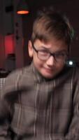 vertical Boy holds game console joystick and hits controller with his hands in anger video
