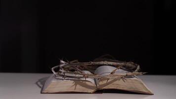 Crown of thorns resting on open bible symbolizing sacrifice and redemption video