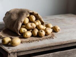 A sack of potatoes on a wooden table photo