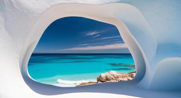 A window in a white building overlooking the ocean photo