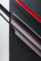 A black and red wall with red lines photo