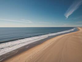A beach with sand and water on it photo