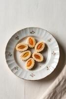 A plate with cookies on it and a napkin photo