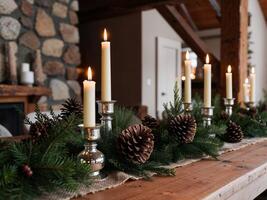 A long table with candles and pine cones on it photo