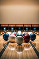 A row of bowling balls sitting on top of a bowling alley. photo