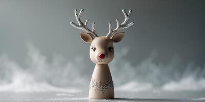 Delicate Reindeer Toy on Blurred Grey Background photo