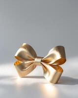Elegant Gold Bow to Add a Touch of Luxury to Special Occasion Gifts photo