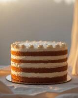 A cake with frosting on top on a table photo