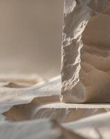 A close up of a rock on a sand surface photo