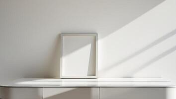 A white desk with a picture frame on it photo