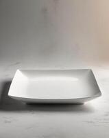 Elegant White Rectangular Plate on Gray Background for Culinary Presentation photo