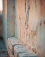 Gentle Weathered Stone Wall with Soft Focus Lighting photo