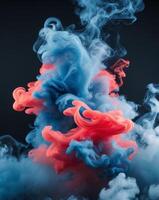Abstract Blue and Red Smoke Swirls on Black Background photo