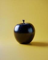 An apple on a yellow background photo