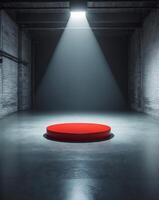 Red Circular Platform Illuminated by Spotlight in Empty Industrial Room photo