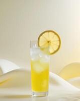 Refreshing citrus drink with ice and lemon on a light background photo