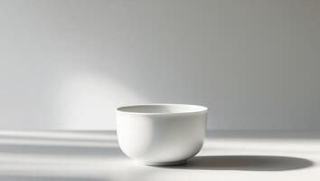 there is a white cup sitting on a table with a shadow photo