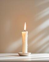 Burning candle creating cozy ambiance for meditation and relaxation photo