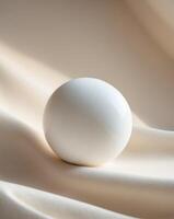 a close up of a white round object on a beige surface photo