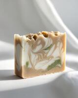 A handcrafted bar of natural soap with marbled texture photo