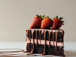 A slice of chocolate cake with strawberries on top photo