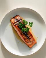 Grilled Teriyaki Salmon Steak with Parsley Garnish photo